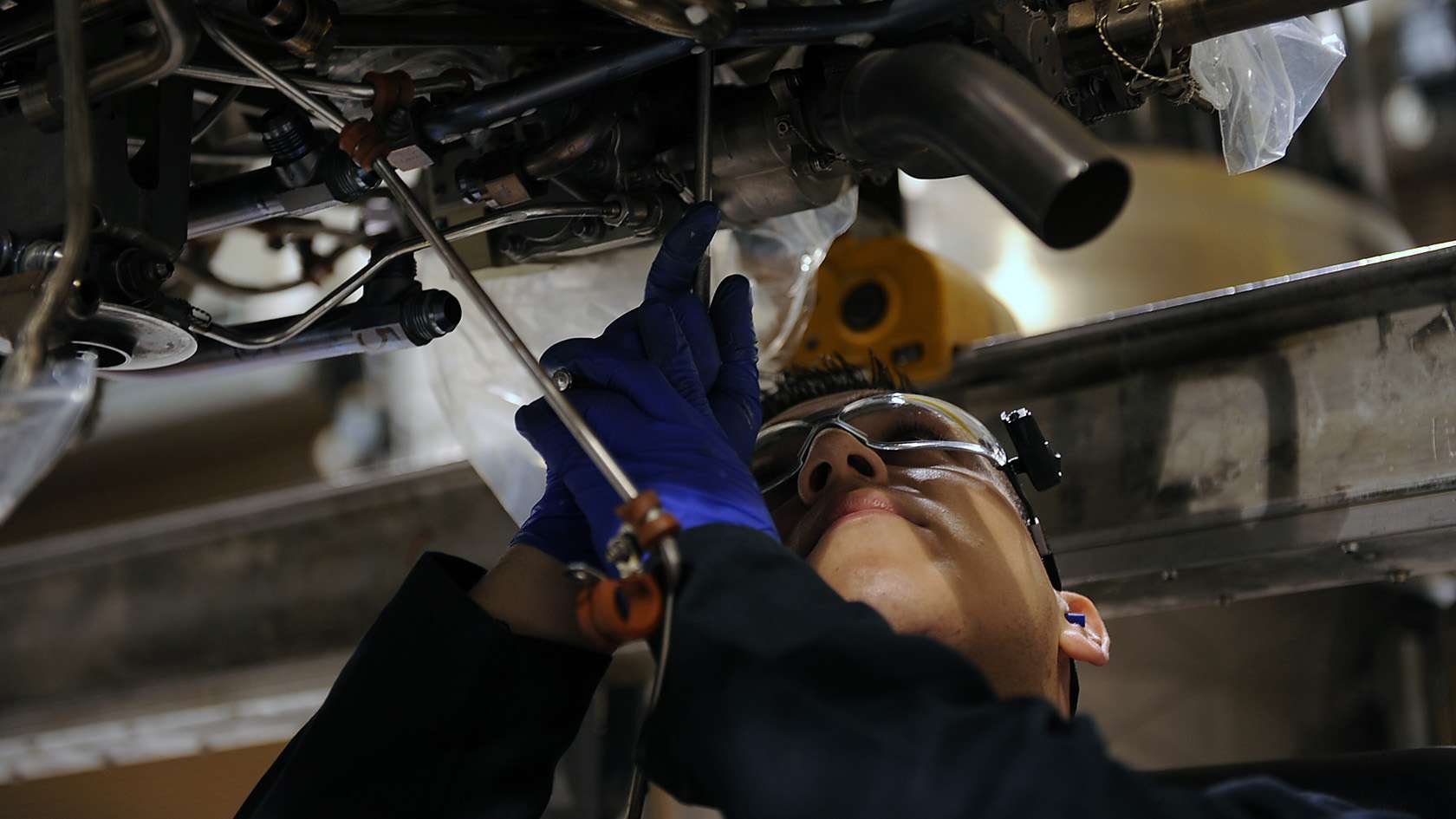 Aerospace propulsion Airman inspecting an engine