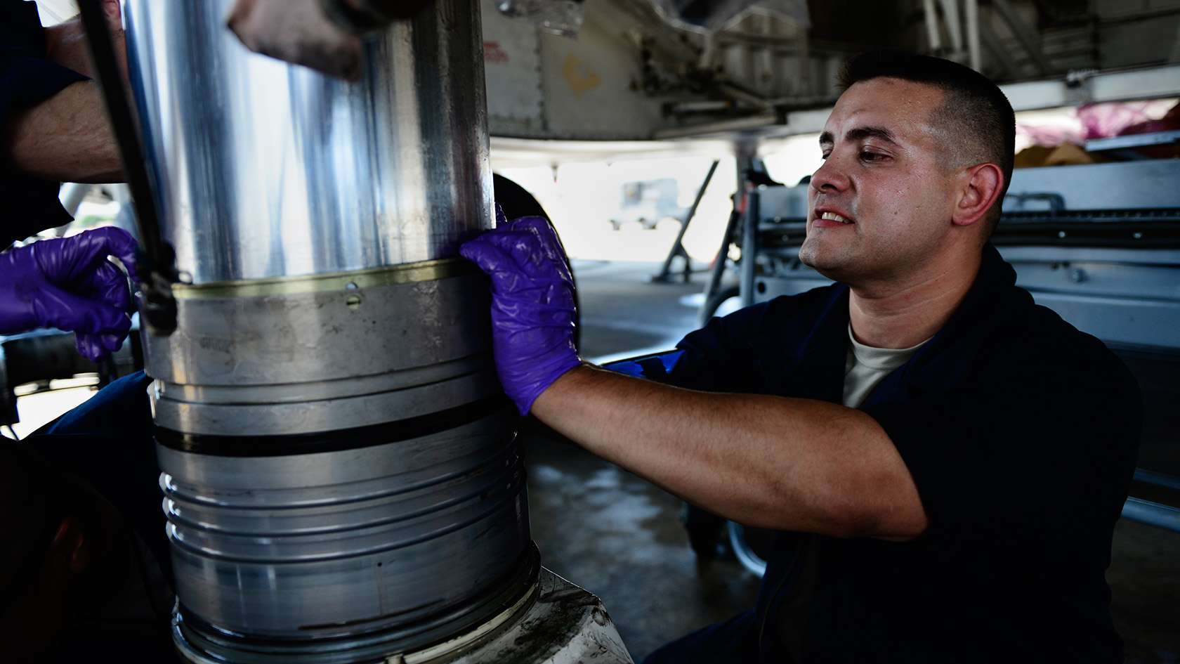airman performing maintenance