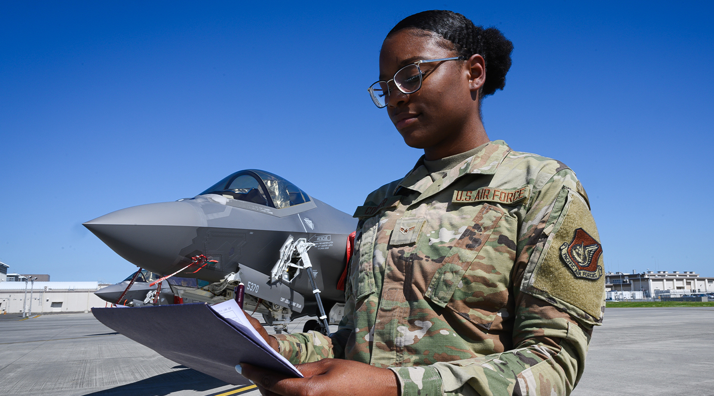 aviation resource manager on the flight line with an F-22