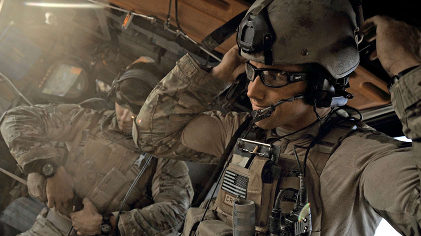 Two Combat Rescue Officers inside helicopter