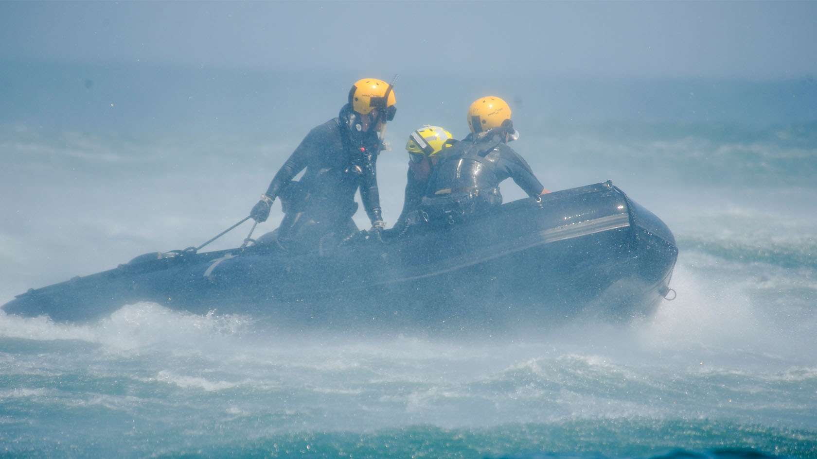 Combat rescue officers on an inflatable raft