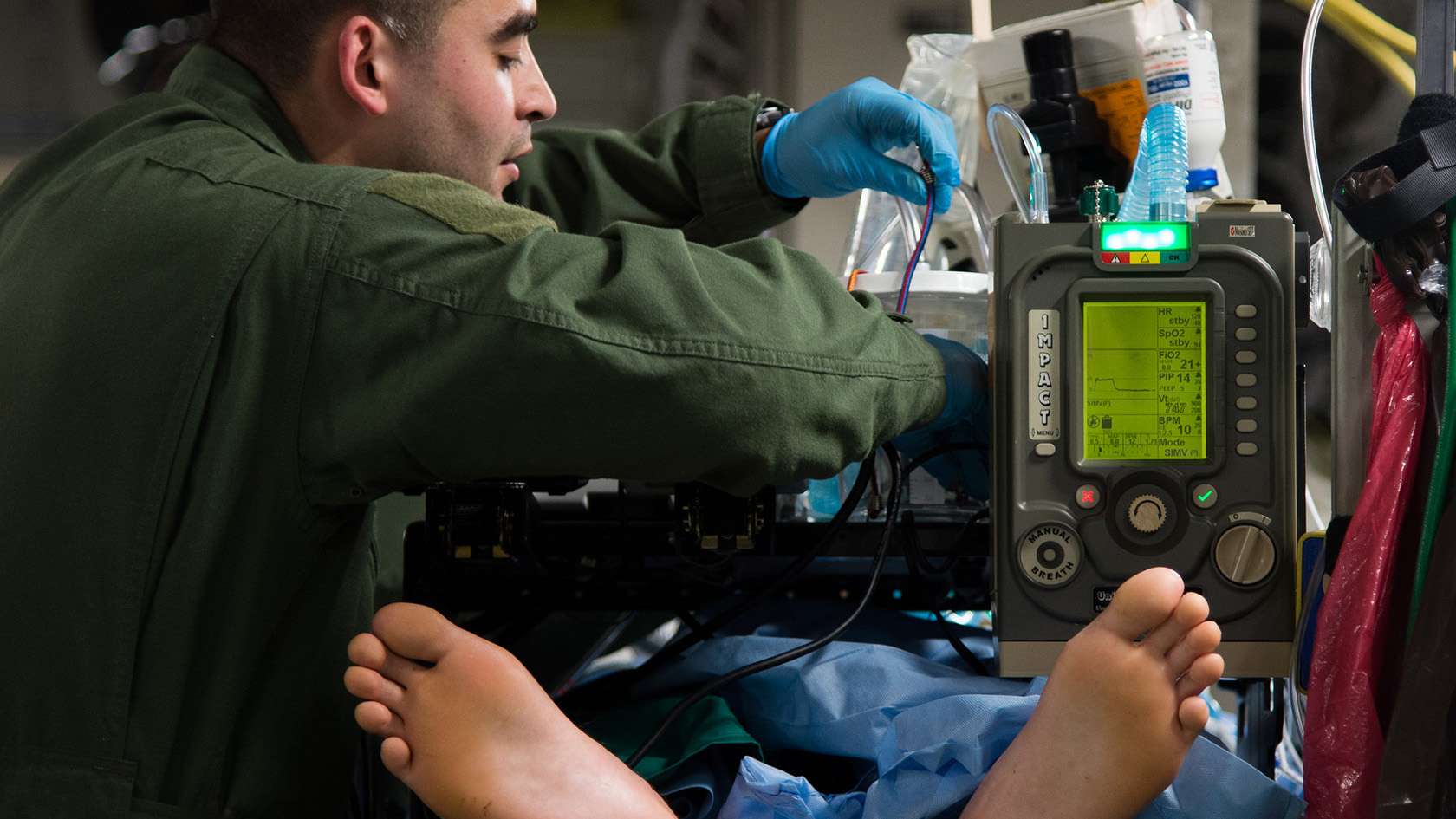 Critical Care Medicine Physician attending to a patient