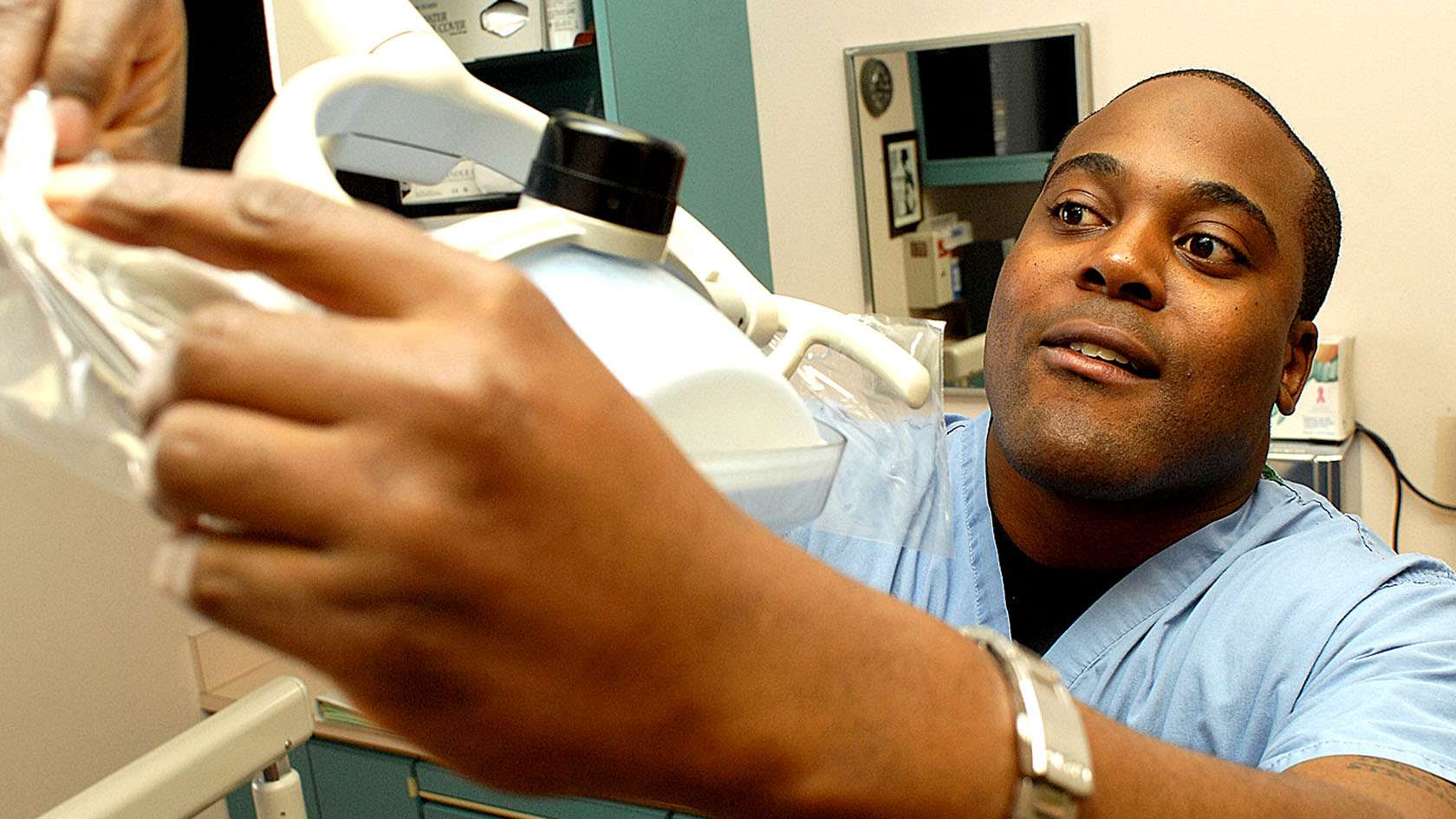 dental assistant preparing equipment