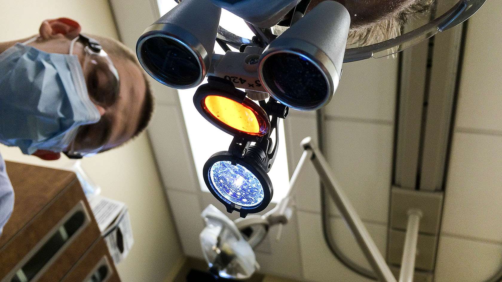 patient's point of view looking up at dental assistant 