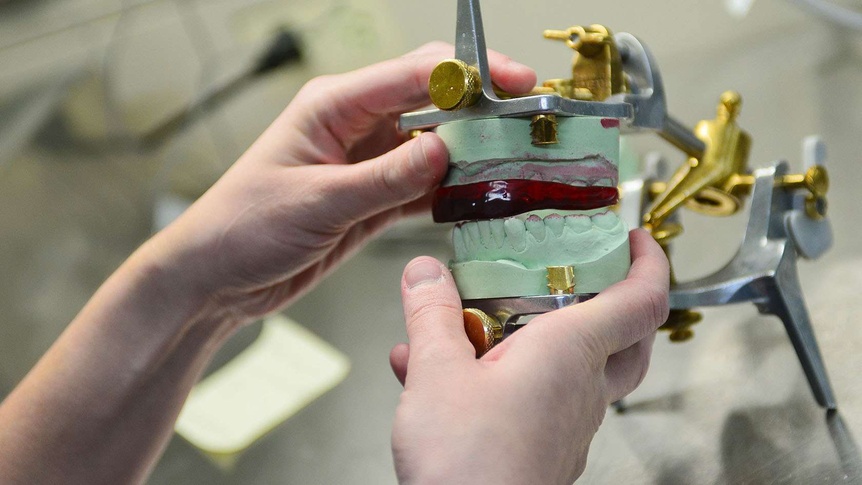 dental lab specialist working on a prostheses