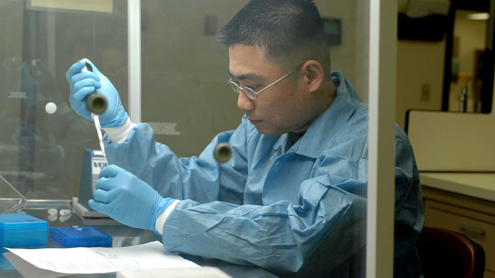Air Force histopathologist using a pipette