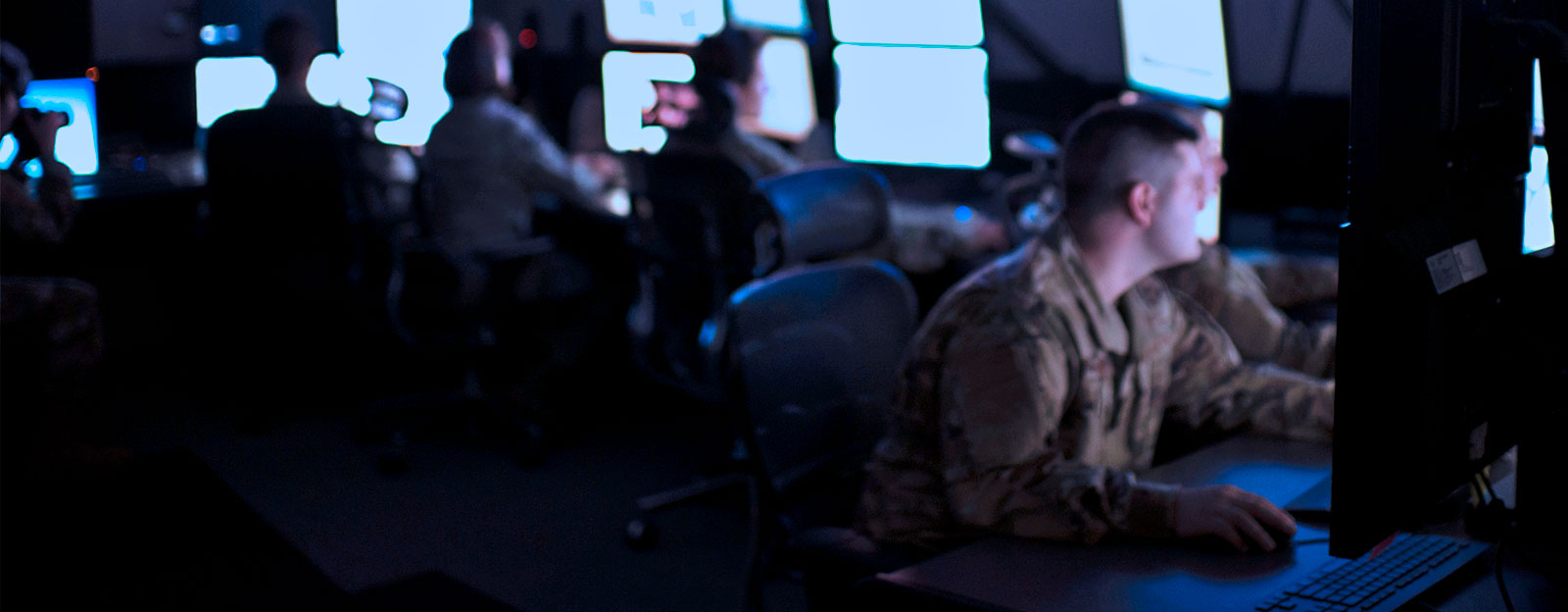 Intelligence Analysts working at computers