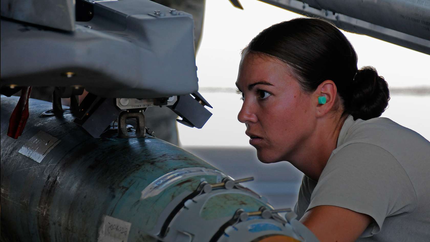 airman working on munitions