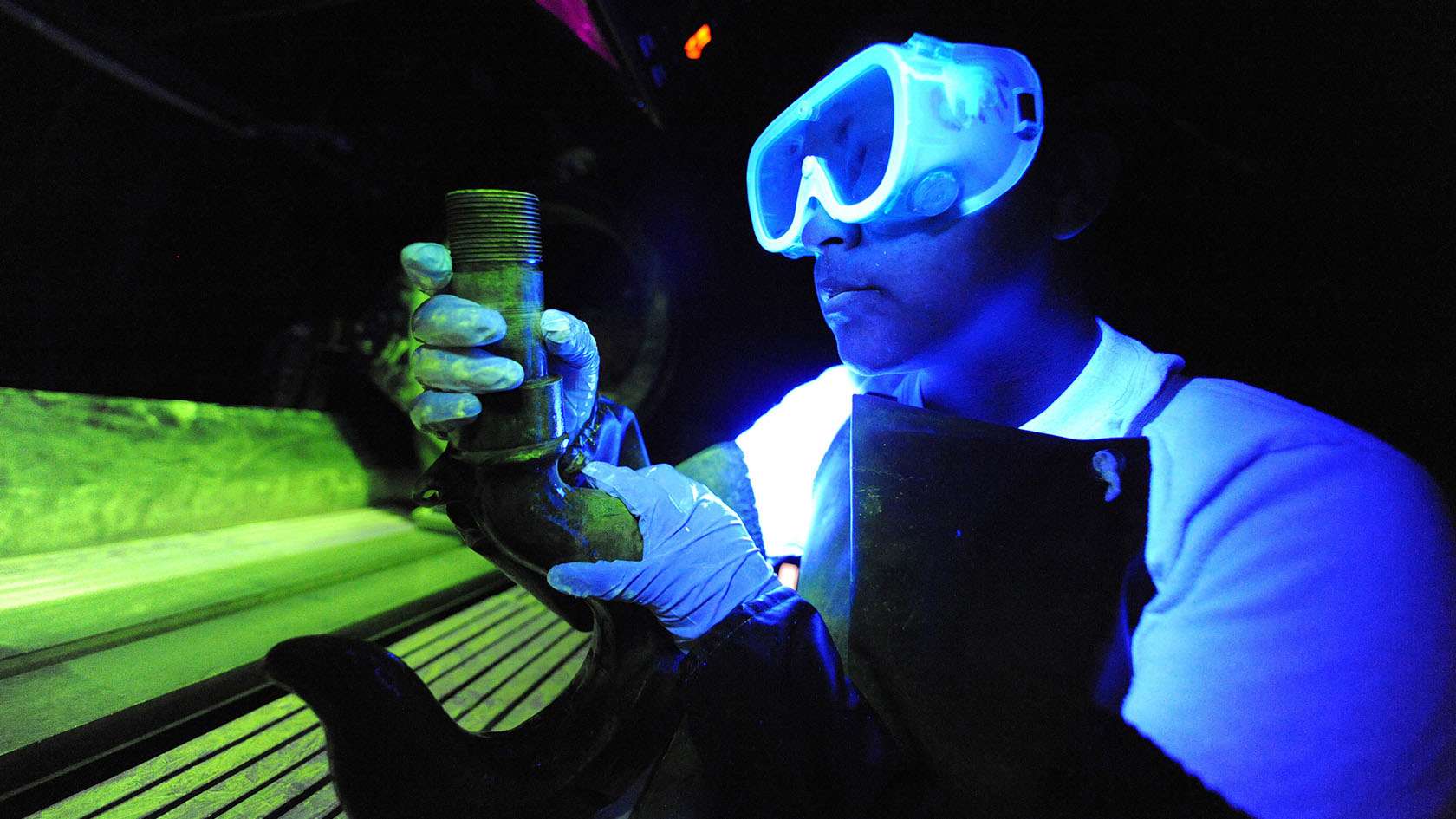 nondestructive inspection specialist analyzing metal