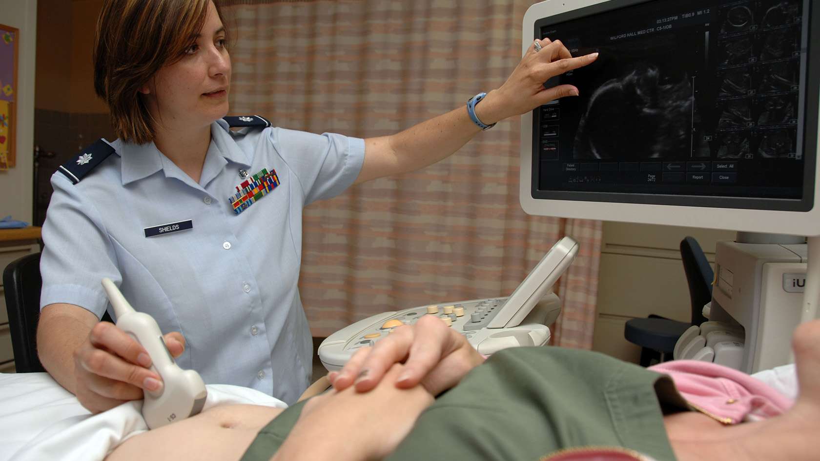 OBGYN providing a sonogram