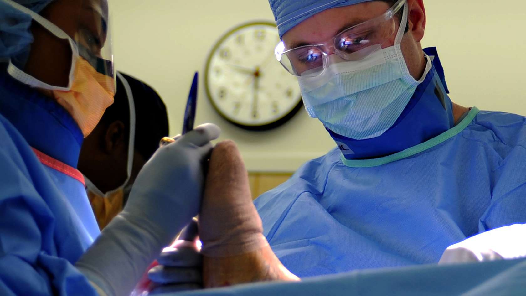 orthopedic surgeon and his team working on a patient