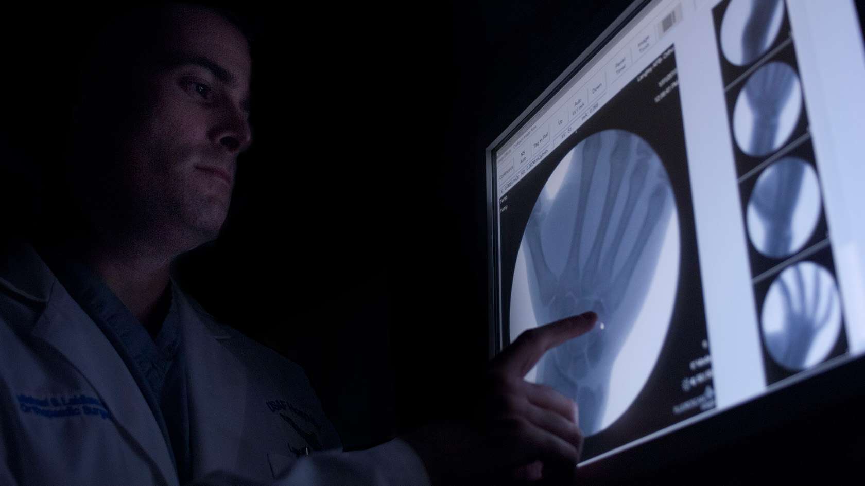 orthopedic surgeon analyzing x-rays