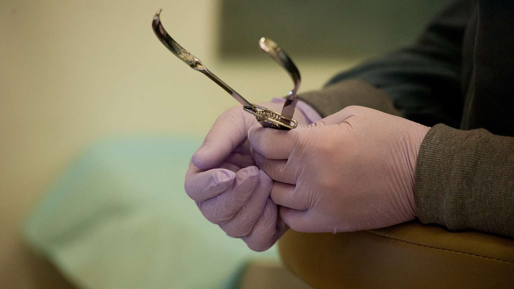 hands with dental tool
