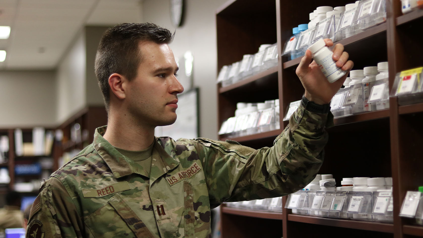 airforce pharmacist interacting with patients