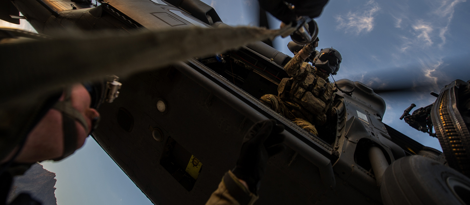 airman dropping a hoist from a helicopter