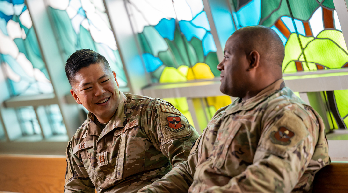 Chaplain talking to an Officer