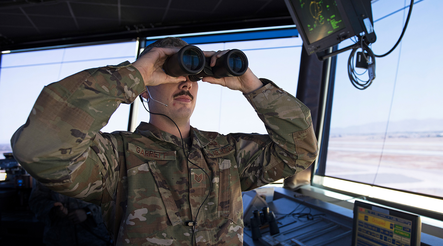 airmen with binocculars
