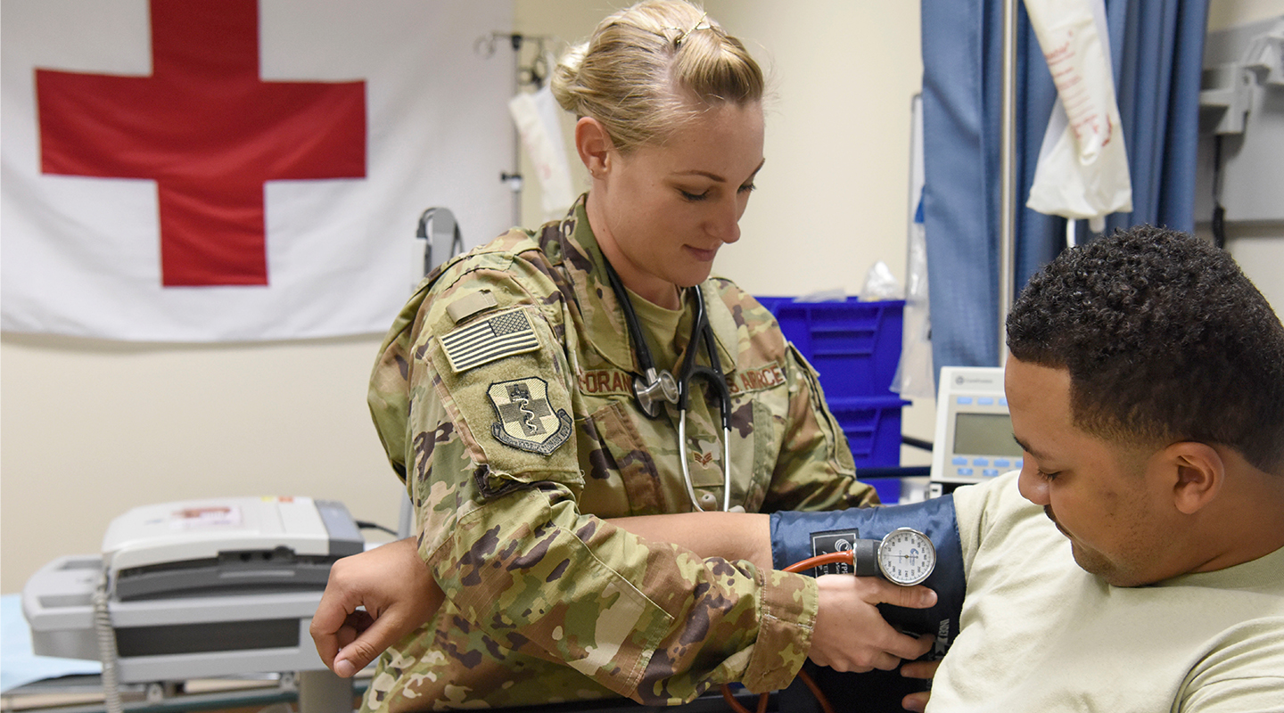 aerospace medical service checking patient's blood pressure