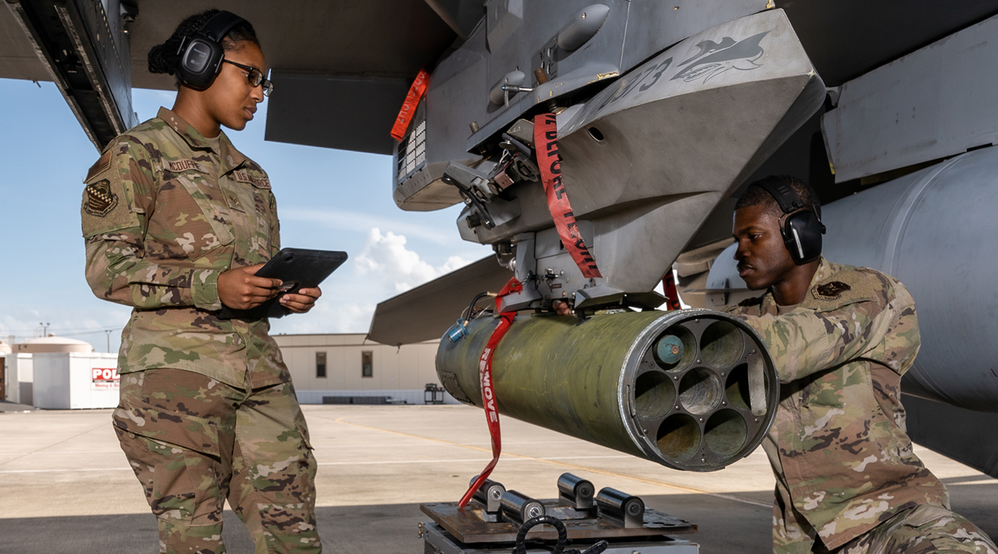 airmen working on aircraft
