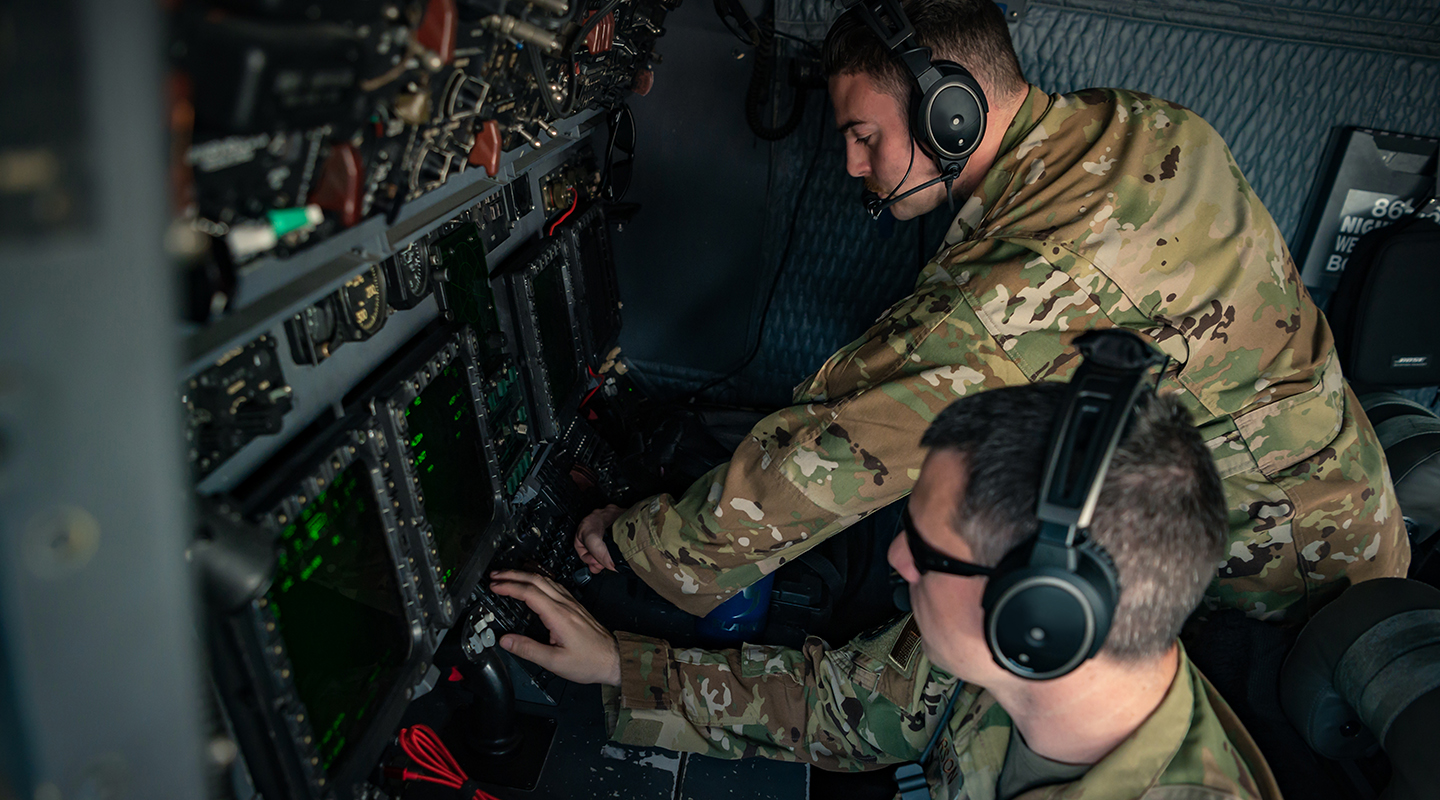 airmen working on equipment