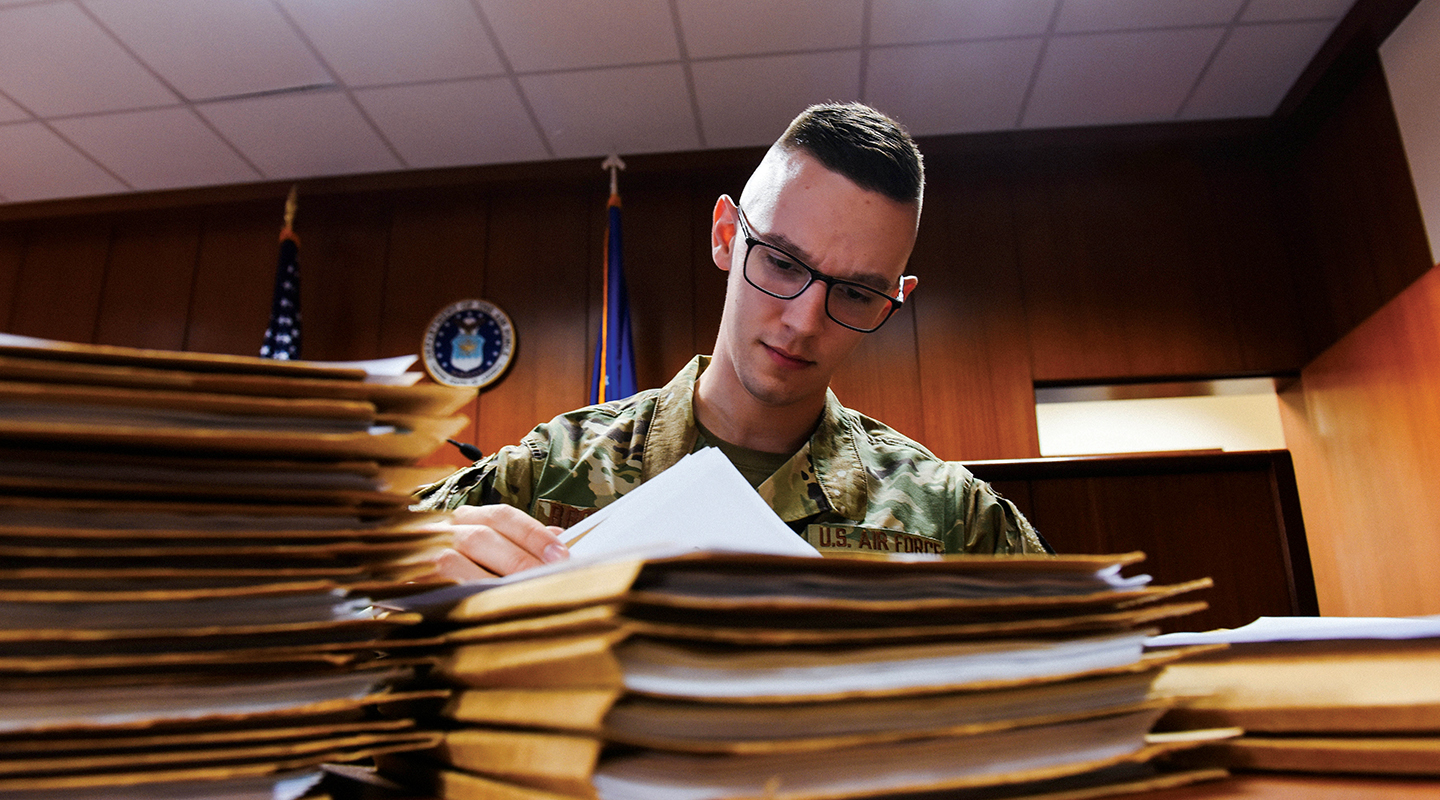 airman reviewing documents