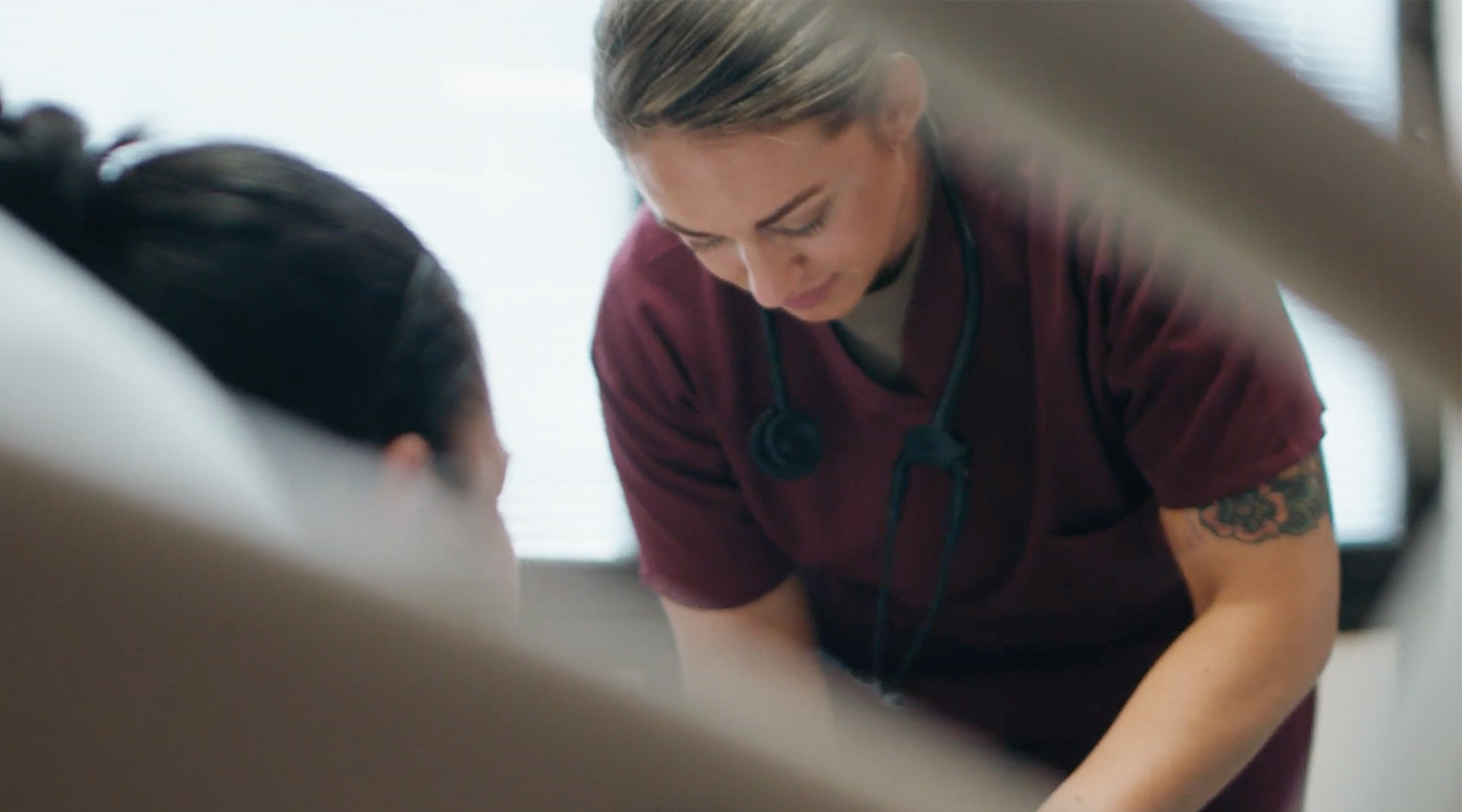 CLINICAL NURSE examining a patient