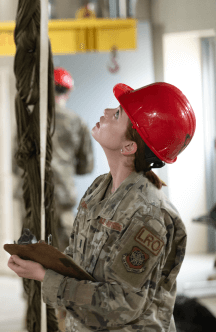 female airman in hardhat